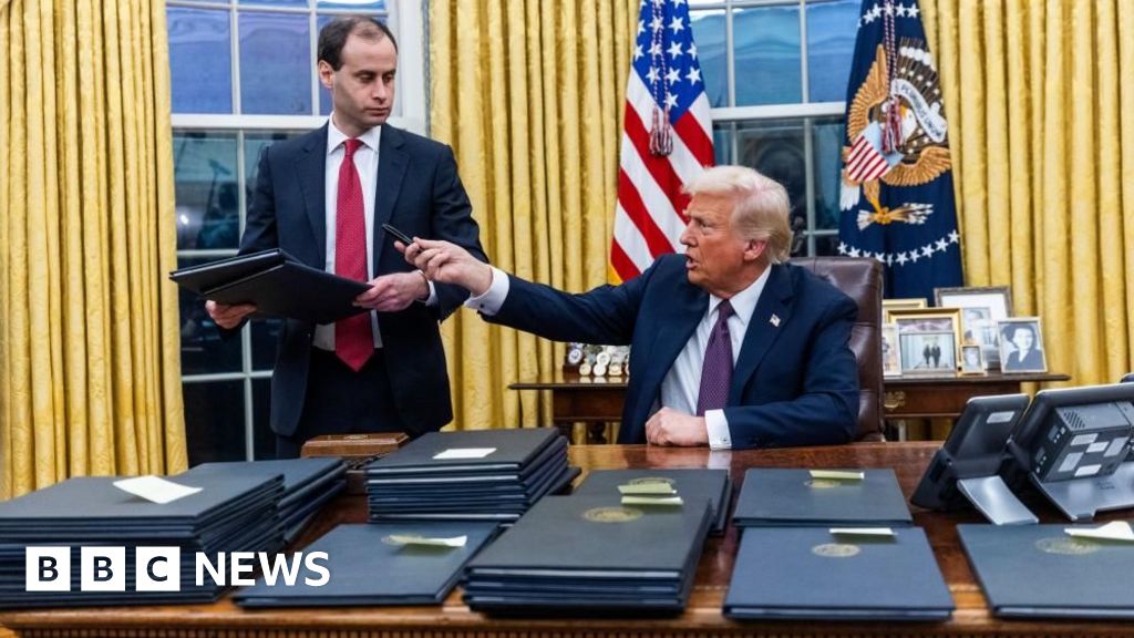 What executive orders did Trump sign on day one?